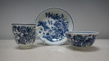 An early Worcester blue and white Trio, fence pattern, cup, tea bowl and saucer, crescent mark