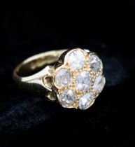 A Diamond flowerhead Cluster Ring pavé-set seven old-cut stones in 18ct gold ring size K, approx 7.