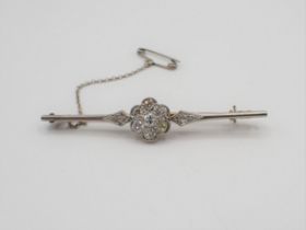 A Diamond Bar Brooch millegrain-set cluster of seven old and brilliant-cut stones between two