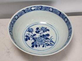 A 19th Century Chinese large blue and white Bowl decorated dragons and flowers in a landscape with