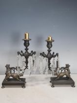 A pair of bronze Table Lustres with prismatic drops, the rectangular bases mounted with dogs, 10 1/