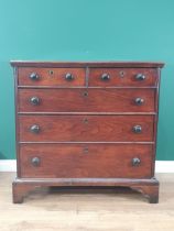 An early 19th Century Welsh oak Chest of two short and three long drawers with turned wood handles