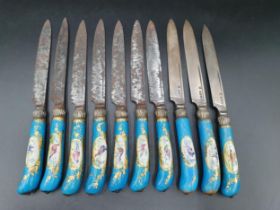 Ten porcelain pistol grip handled Knives painted exotic birds in oval reserves, turquoise and gilt