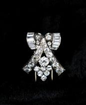 An Art Deco Diamond Clip claw, channel and pavé-set old and baguette-cut stones, 22mm long