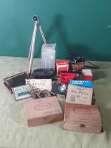 A box of Camera Equipment including magazine, view finders, flash, microscope dry plates, a