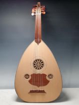 A professional quality Oud made in Morocco, the barrel back with satinwood stringing and having
