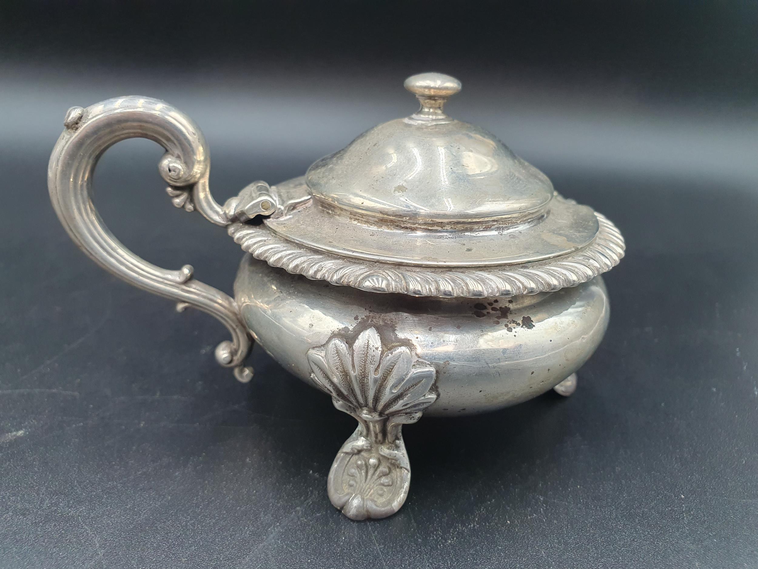 A George III silver large circular Mustard Pot, semi-fluted on anthemion and paw feet, London - Image 5 of 7