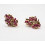 A pair of Ruby Flower Spray Ear Clips each claw-set twelve round stones, marked Garrard, London,