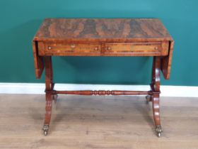 A Regency style rosewood veneered and brass inlaid Sofa Table on lyre shaped end supports united