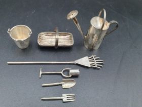 A modern silver miniature Watering Can, Trug, Bucket, Rake, Dibber, Trowel and Fork