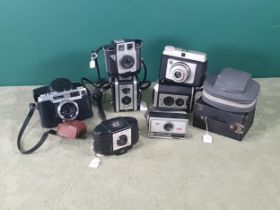 A Yashica Minister-D Camera, two Ensign blue cased Box Cameras and a selection of box and other