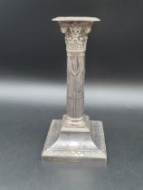 A Victorian silver Candlestick with partly fluted and swag decorated column, Corinthian capital on