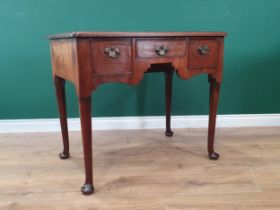 A George II mahogany Lowboy with moulded top fitted three frieze drawers raised on turned