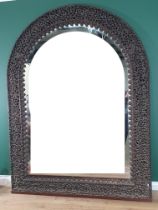 A large impressive Burmese carved arched Mirror, with finely pierced and carved frame of flowers and