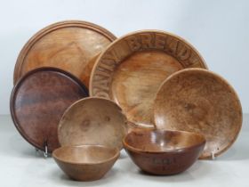 A small collection of Treen Bowls including one with carved inscription 'For Our Daily Bread',