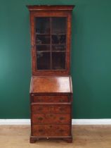 An antique Queen Anne style walnut Bureau Bookcase, the single glazed door above the fall front