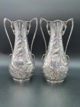 A pair of Edward VII Art Nouveau silver two handled Vases finely embossed poppies, Birmingham