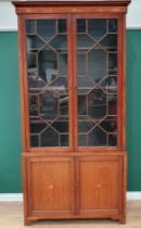 A 19th Century mahogany Bookcase with pair of astragal glazed doors above pair of solid panelled