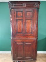 A Georgian oak Double Corner Cupboard with two pairs of panelled doors on plinth base