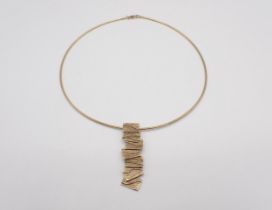 A Sheila Fleet (Orkney Designer Jewellery) 9ct gold Torque Necklace with textured tile effect