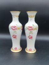 A pair of Wm Moorcroft MacIntyre slender baluster Vases with tube lined floral decoration in pink,