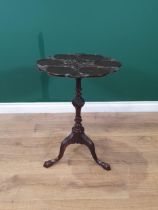 A Georgian mahogany Table, the shaped top with six dished sections, carved leafage and rosette