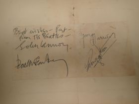 A photograph of The Beatles, bearing printed 'Star' and SP582 and a signed paper reading 'Best