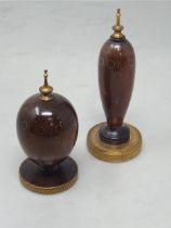 A turned cocobola wood Scribe's Egg with ten inset circles engraved T. Faberge, 1984 to base 4in