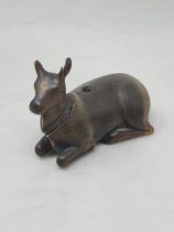 A carved horn Pen Holder in the form of a recumbent goat with detachable head, A/F, 4in x 2in