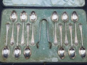 One dozen Edward VII silver Coffee Spoons and Sugar Tongs with engraved decoration, Sheffield