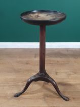A Georgian mahogany Kettle Stand the circular dished top, supported by gun barrel column, raised