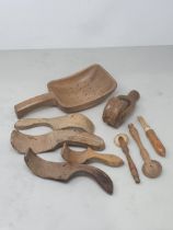 A collection of treen items including a Butter Roller, four Butter Curlers, a Dairy Strainer and two