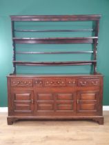 An 18th Century oak Dresser and Rack, rack with shaped sides, base fitted five drawers with two
