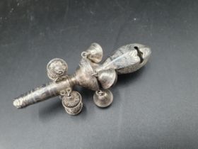 A 19th Century silver Rattle with whistle and nine bells, leafage engraved friezes, one bell