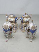 A pair of 19th Century Continental Pot Pourri of ovoid form with scaled blue design with reserves of