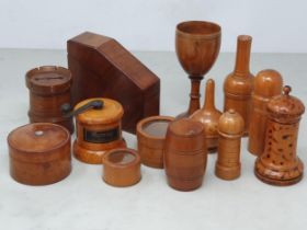 A collection of assorted treen Containers including a boxwood Glove Powderer, a treen domed top