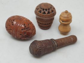 Two carved coquila Nuts, a carved treen Case enclosing corkscrew A/F, and another turned nut
