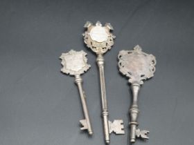 An Edward VII silver Key with presentation inscription Ystrad Fechan, Birmingham 1904, and two other