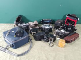 Two Zenit E Cameras, in cases, a Practica PL Camera, a Vivitar 28-200mm zoom lens, A/F, and a