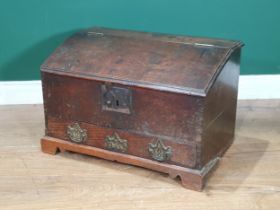 An antique and later oak Bible Box the hinged lid enclosing two fitted drawers, above single long