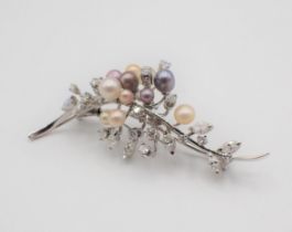 A Cultured Pearl and Diamond Spray Brooch set cultured pearls in various colours amongst marquise