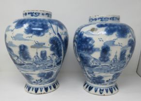 A near pair of 18th Century Delft blue and white Jars painted with panels of hare coursing and a