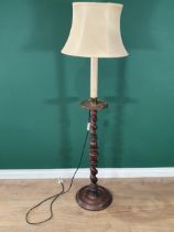 An antique turned mahogany Pricket Type standing Candlestick with barley twist turning, on a