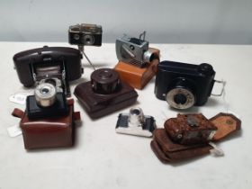 A small collection of miniature Cameras including a Coronet Midget in case, a Minute 16, in case,