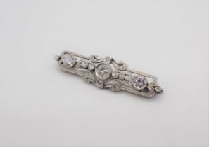 An Art Deco style Diamond Brooch millegrain-set throughout brilliant and eight-cut stones in 14ct
