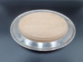 A plated oval Cheese Stand with inset wooden chopping board, 11 x 9in, Provenance: Reputedly