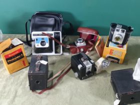 A quantity of Box Brownie Cameras, an Instant Camera, and others