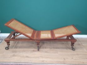 A Campaign Day Bed stamped Robinson's & Sons, Ilkley, Patent, with adjustable cane panels, raised on