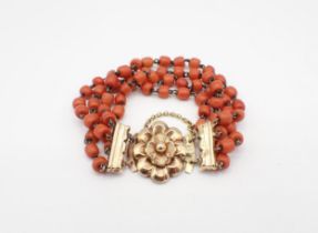 A four strand Coral bead Bracelet on gold rosette clasp