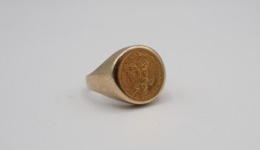 A 9ct gold Signet Ring set Dos Pesos 1945 gold coin, ring size O approx 6.90gms